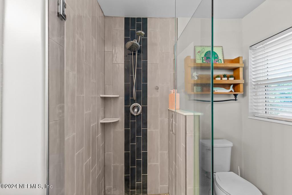 3645 Marianna Road Jacksonville, FL 32217 - Photo 21 of 44 a bathroom with a toilet and shower