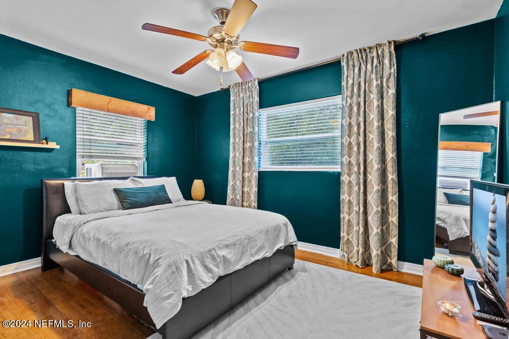 3645 Marianna Road Jacksonville, FL 32217 - Photo 22 of 44 a bedroom with a bed and a chandelier