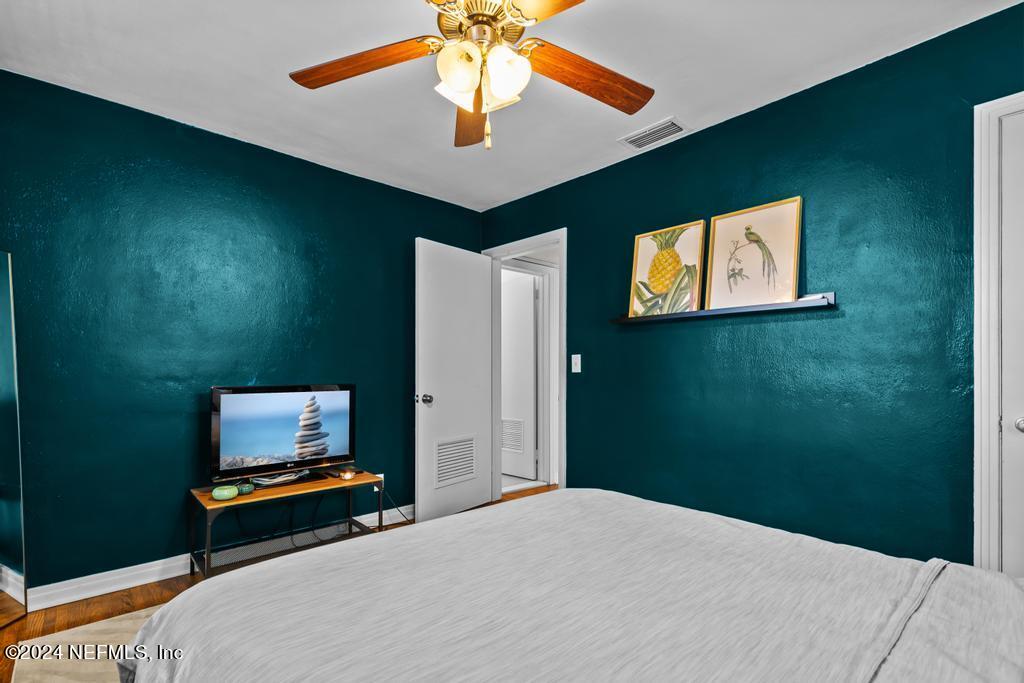 3645 Marianna Road Jacksonville, FL 32217 - Photo 24 of 44 a bedroom with a bed and a ceiling fan