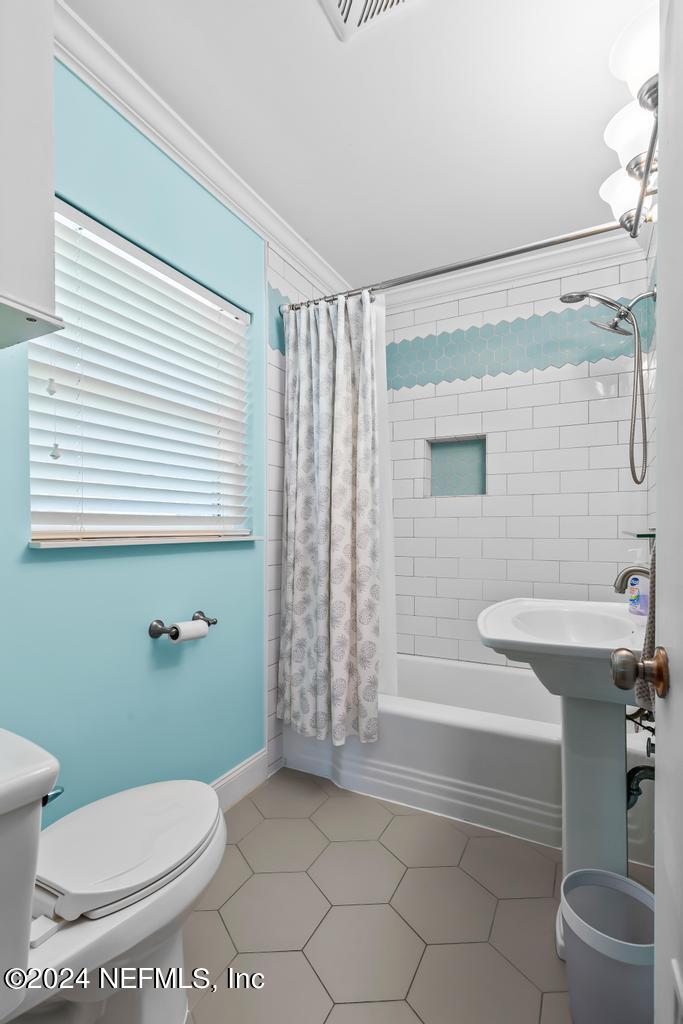 3645 Marianna Road Jacksonville, FL 32217 - Photo 28 of 44 a bathroom with a sink a toilet and shower