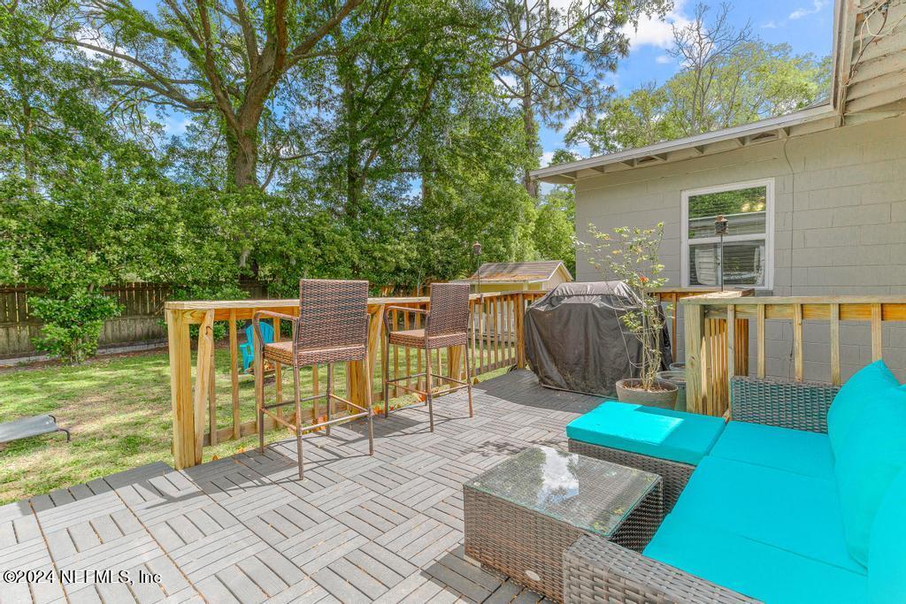 3645 Marianna Road Jacksonville, FL 32217 - Photo 33 of 44 a view of a backyard with wooden floor and iron fence