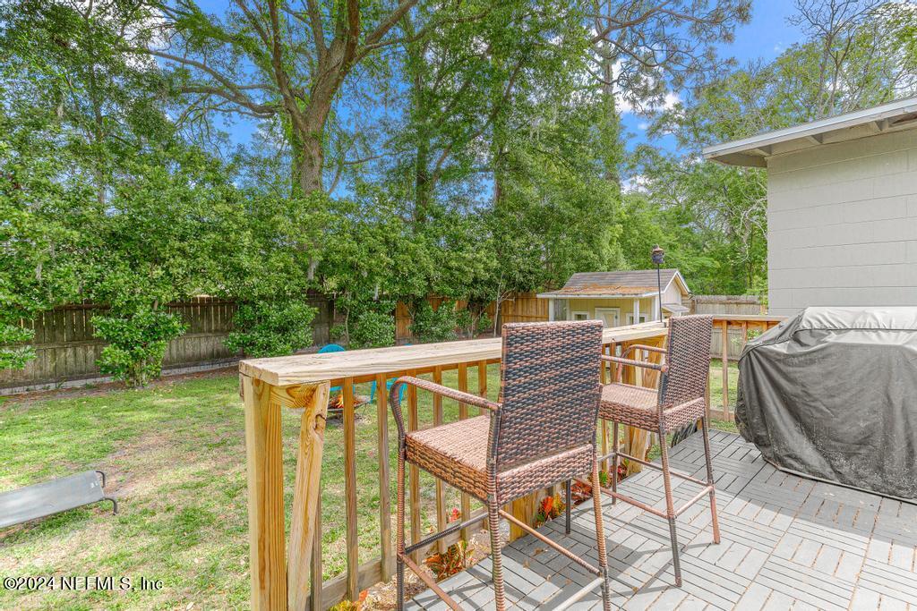 3645 Marianna Road Jacksonville, FL 32217 - Photo 35 of 44 a view of a patio with table and chairs and couches