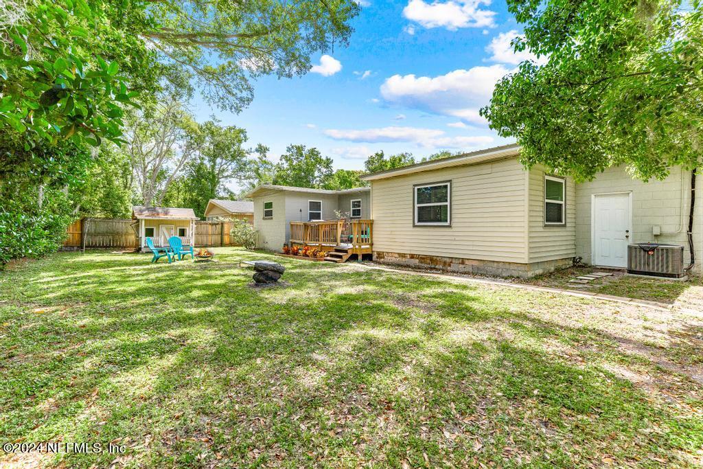 3645 Marianna Road Jacksonville, FL 32217 - Photo 38 of 44 a view of a house with pool and a yard