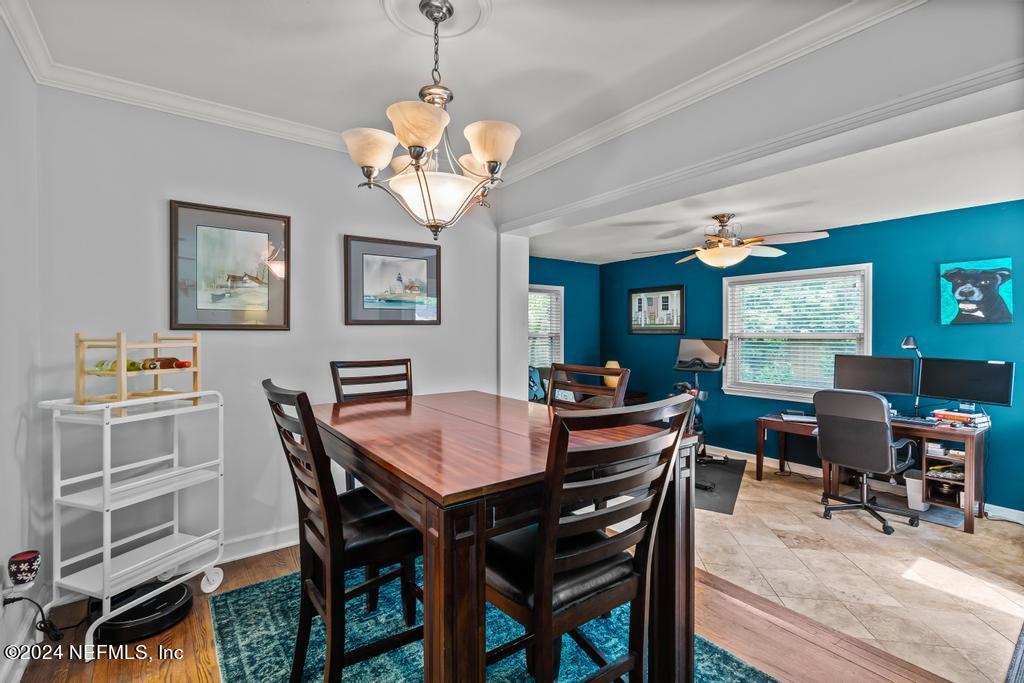 3645 Marianna Road Jacksonville, FL 32217 - Photo 7 of 44 a view of a dining room with furniture window and wooden floor