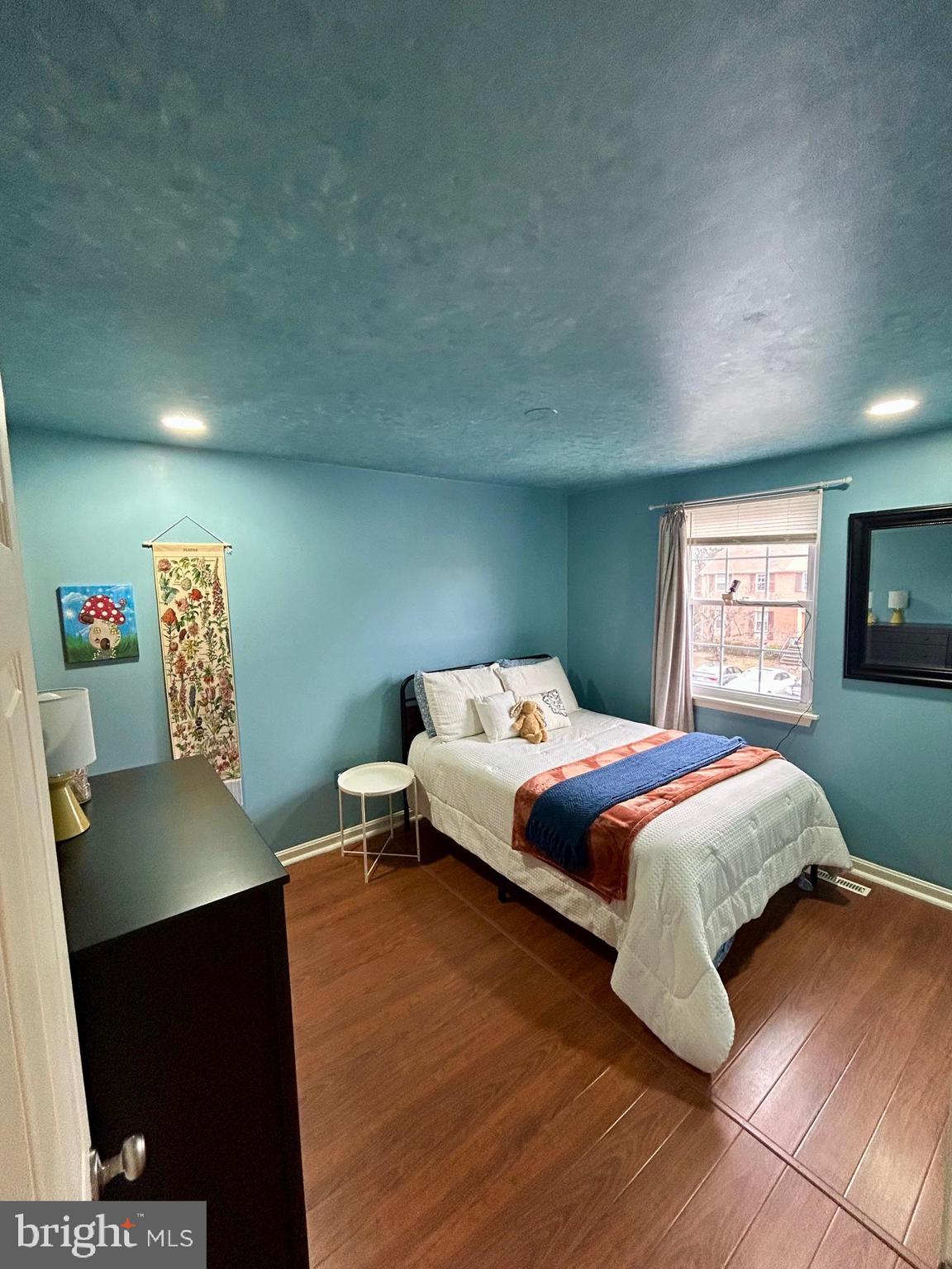 1007 Cape Splitt Harbour Pasadena, MD 21122 - Photo 12 of 19 a bedroom with a bed and a flat screen tv