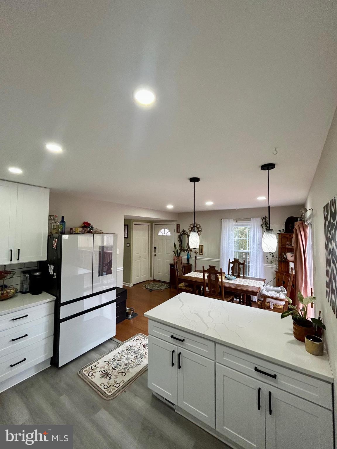 1007 Cape Splitt Harbour Pasadena, MD 21122 - Photo 2 of 19 a large white kitchen with a stove a sink and dishwasher