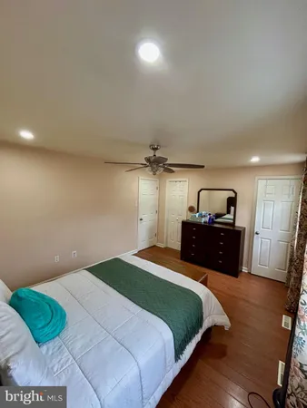 a bedroom with a bed and a tv
