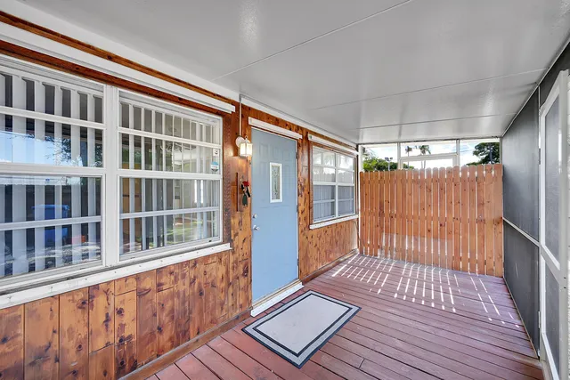 a view of a balcony with wooden floor
