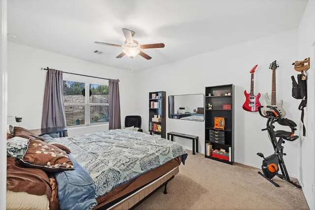 a view of kitchen center island stainless steel appliances wooden floor dining table and chairs