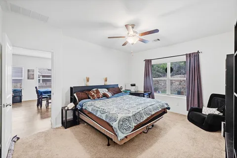 a bedroom with a bed furniture and a window