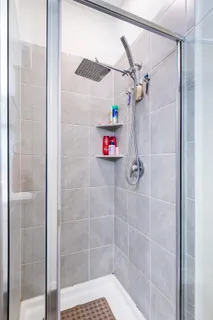 a bathroom with a bathtub and a shower
