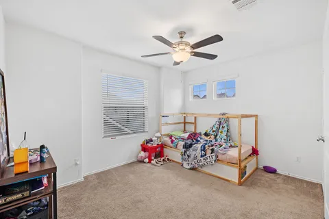 a bed room with furniture and a window