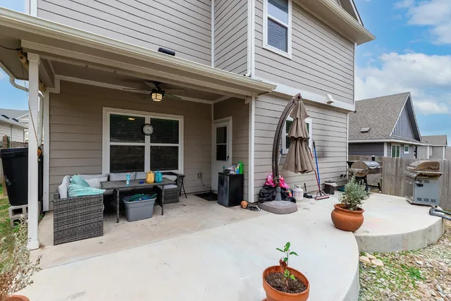 a view of a backyard with plants and a patio