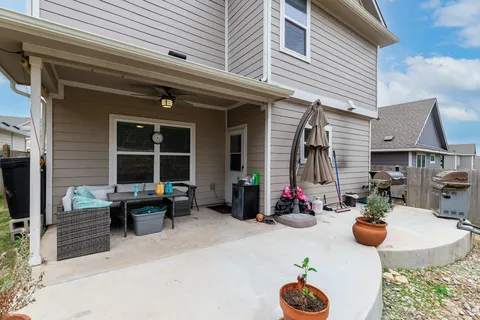 a table and chairs in front of the house