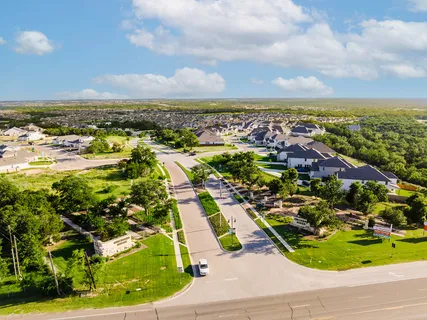 an aerial view of residential houses with outdoor space
