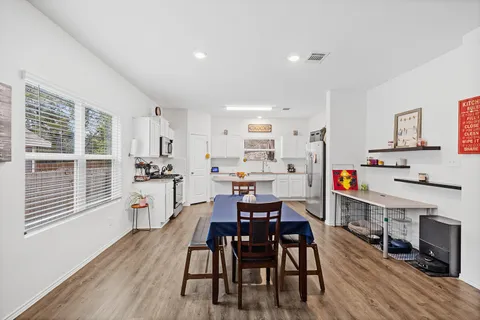 a view of kitchen with cabinets and wooden floor