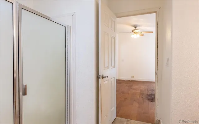 a bathroom with a glass shower door