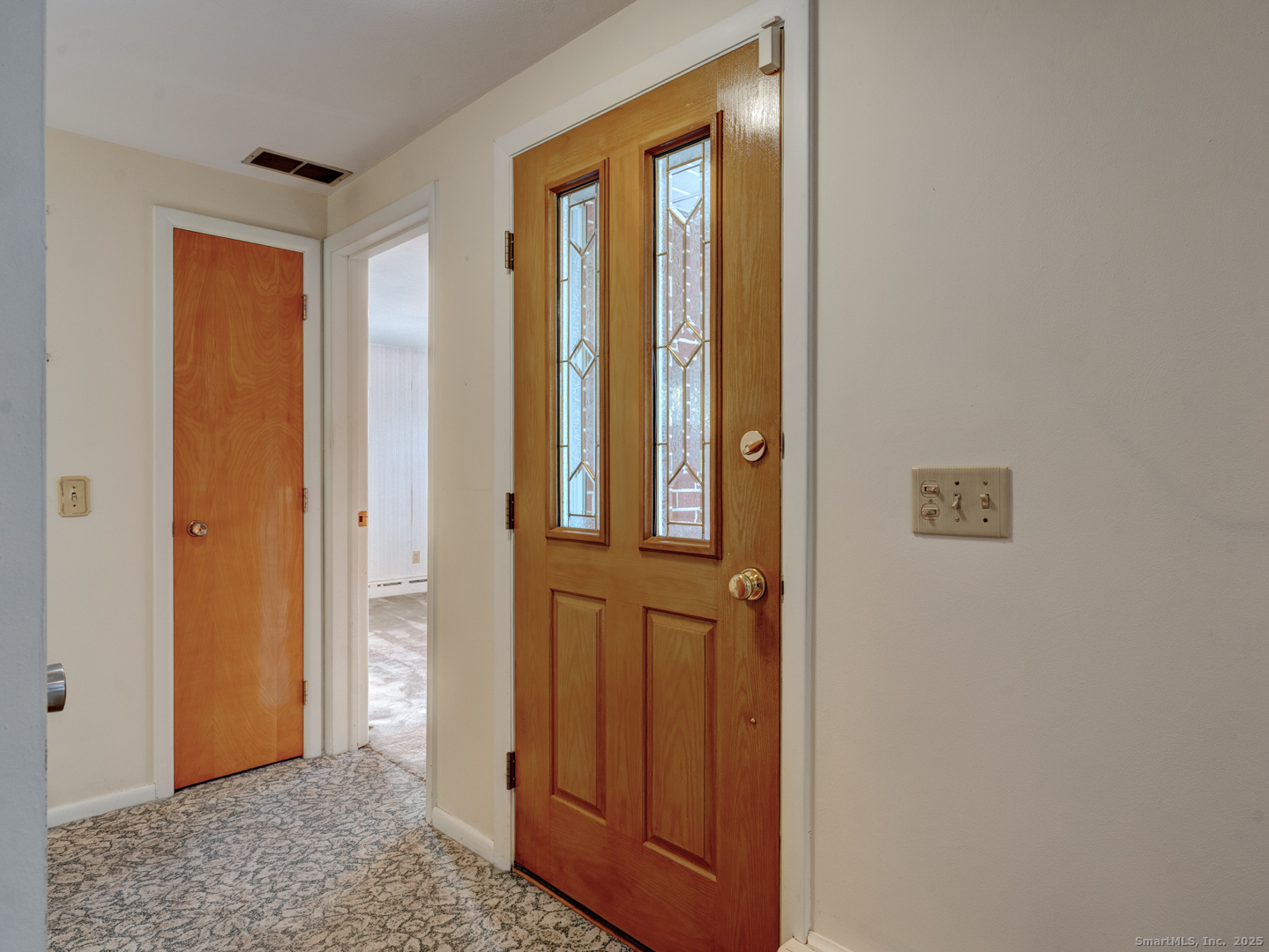 10 McKay Street Torrington, CT 06790 - Photo 13 of 39 a view of a hallway with wooden floor and cabinet