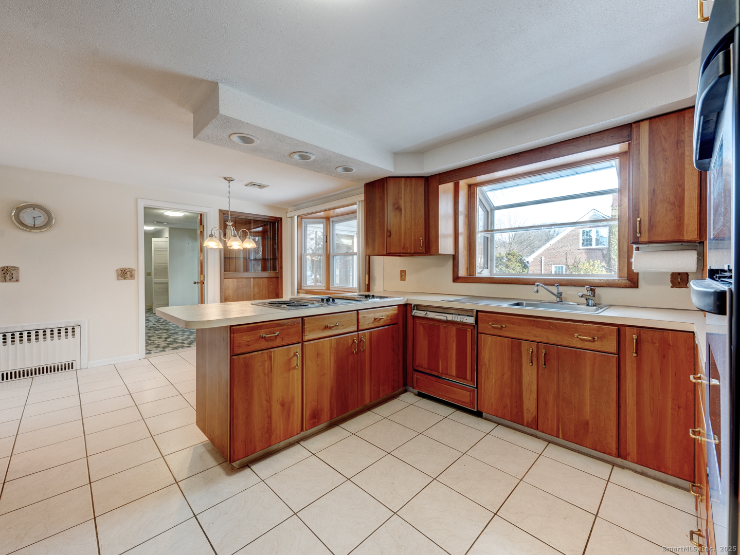 10 McKay Street Torrington, CT 06790 - Photo 21 of 39 a large kitchen with granite countertop a sink window and cabinets