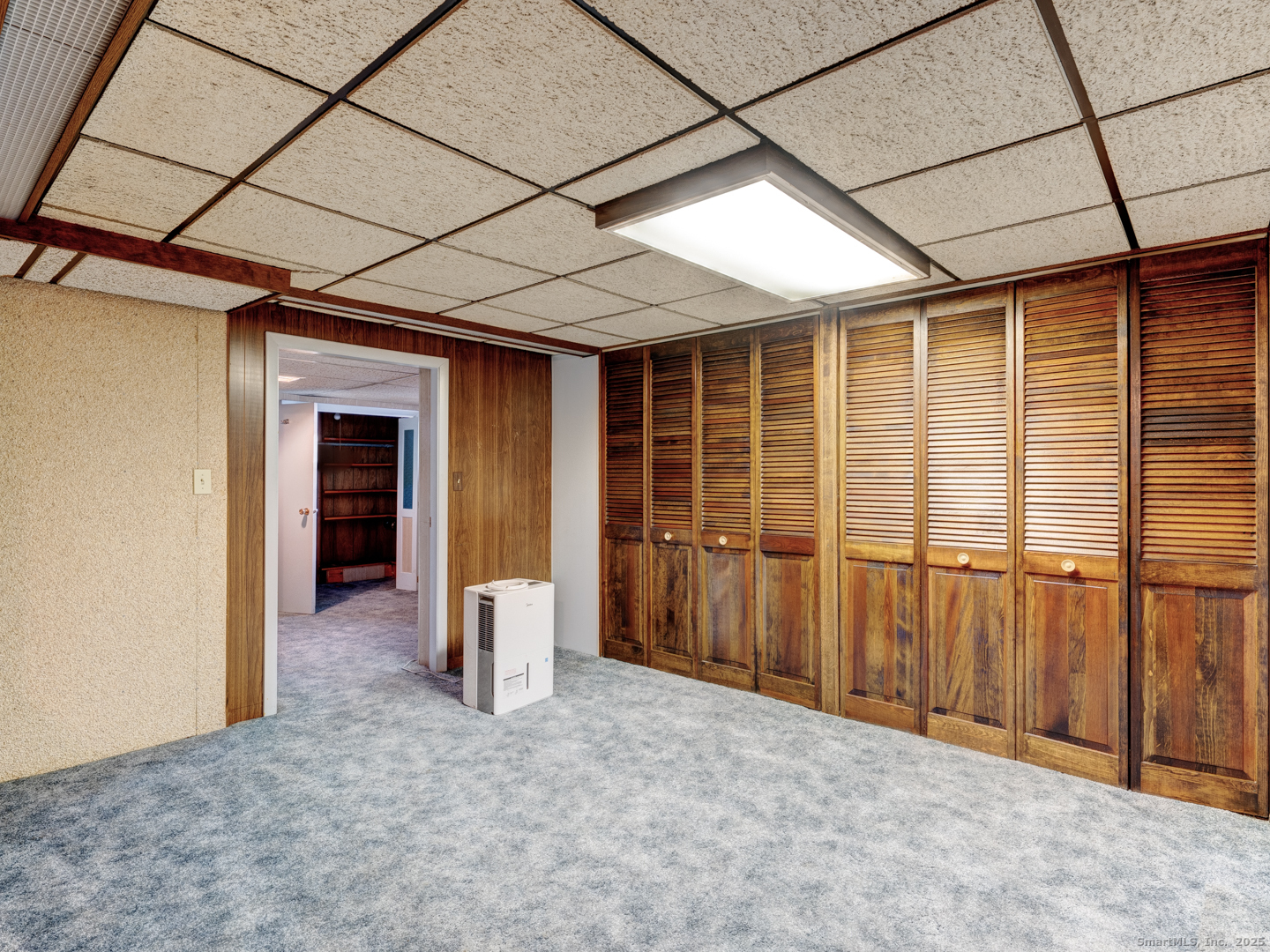 10 McKay Street Torrington, CT 06790 - Photo 33 of 39 a view of an empty room with wooden floor