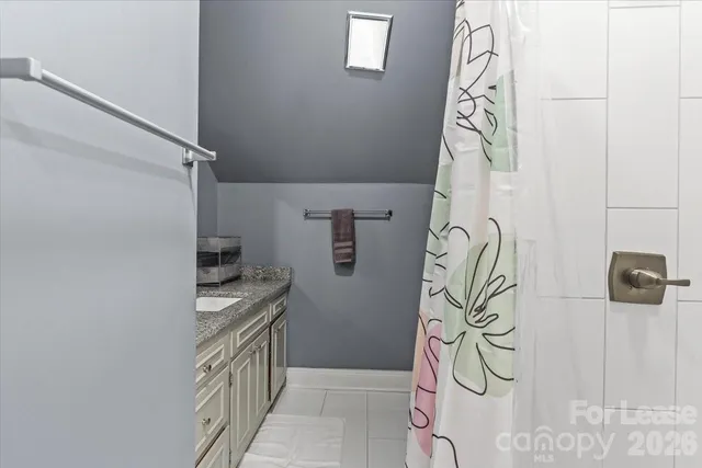 a kitchen with a window and a shower