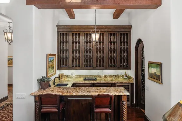 a kitchen with a table and chairs in it