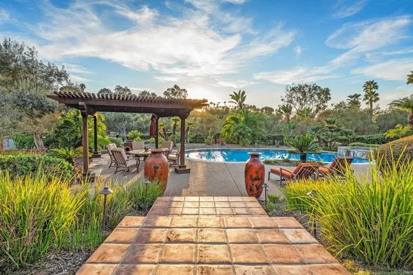a view of swimming pool having outdoor seating