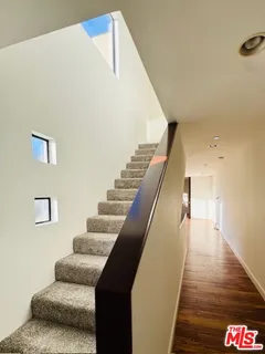 a view of empty room with window and fireplace