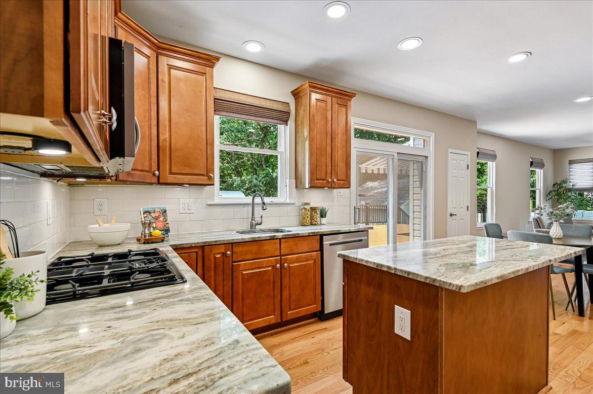 603 Queenstown Road Severn, MD 21144 - Photo 14 of 85 Modern kitchen with warm wood accents.