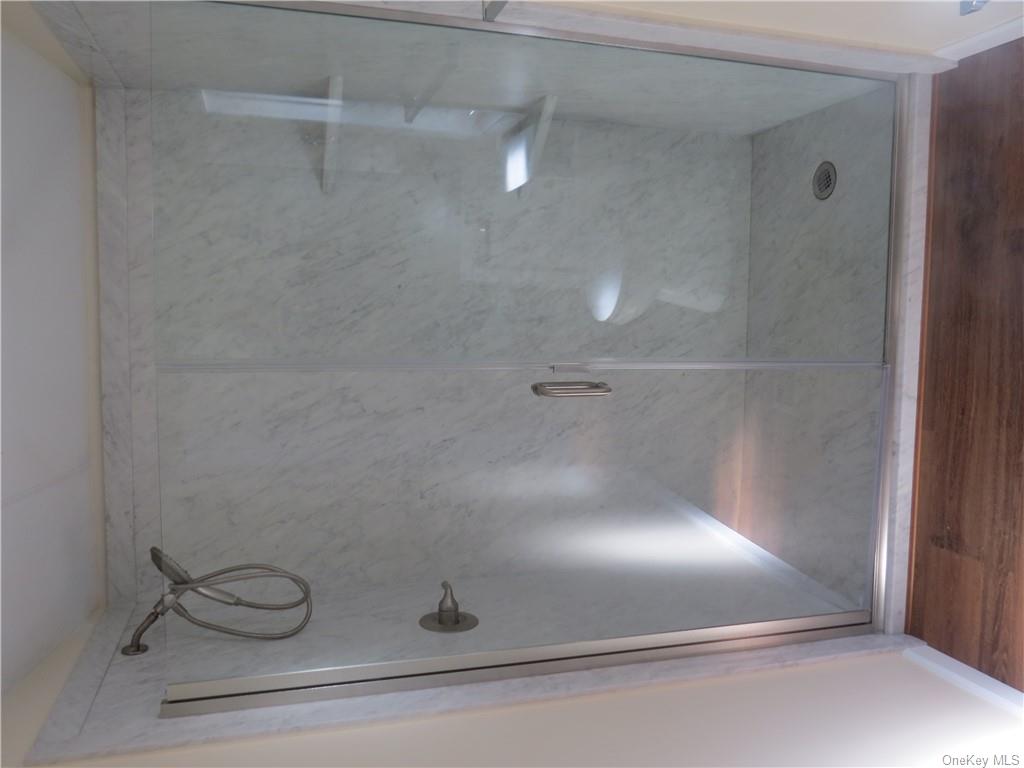 723 Beekman Road Hopewell Junction, NY 12533 - Photo 17 of 33 Bathroom with walk in shower and hardwood / wood-style floors