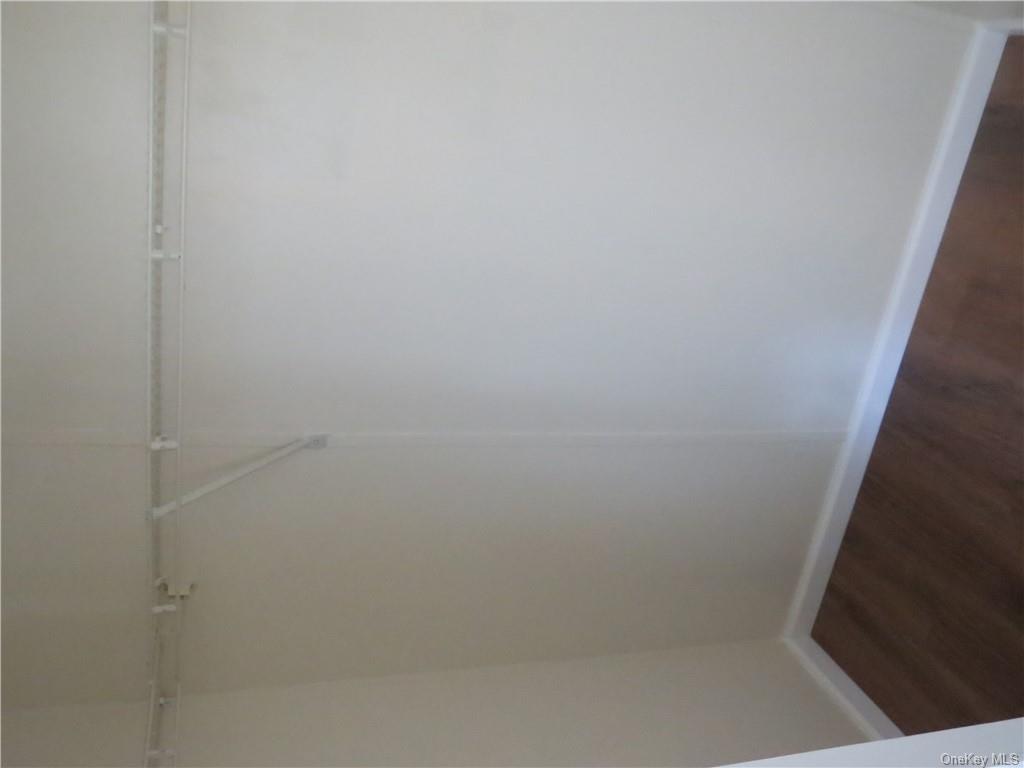 723 Beekman Road Hopewell Junction, NY 12533 - Photo 24 of 33 Walk in closet with dark hardwood / wood-style floors
