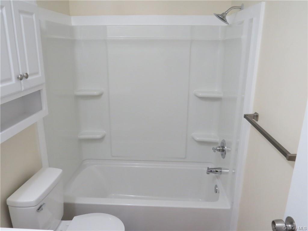 723 Beekman Road Hopewell Junction, NY 12533 - Photo 26 of 33 Bathroom with bathtub / shower combination and toilet