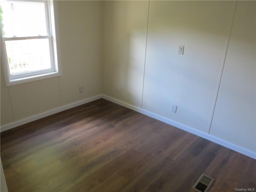 723 Beekman Road Hopewell Junction, NY 12533 - Photo 27 of 33 Unfurnished room featuring dark hardwood / wood-style floors