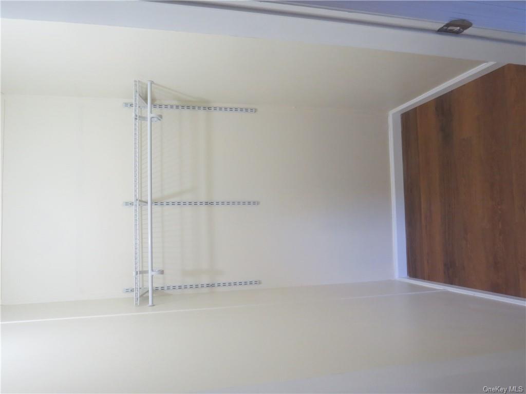 723 Beekman Road Hopewell Junction, NY 12533 - Photo 28 of 33 Walk in closet featuring dark hardwood / wood-style floors