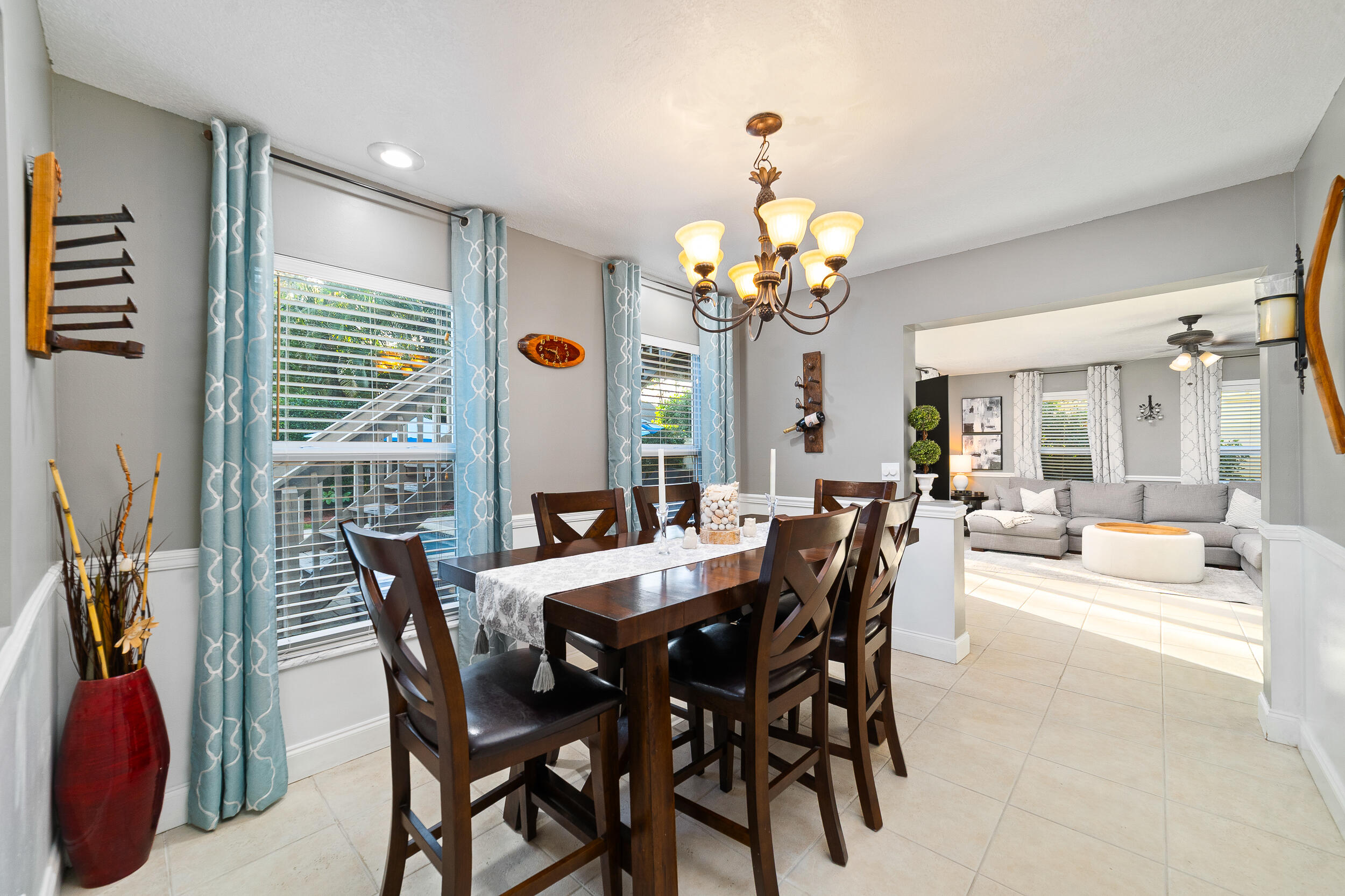 1045 Raintree Lane Wellington, FL 33414 - Photo 11 of 43 a view of a dining room with furniture and chandelier
