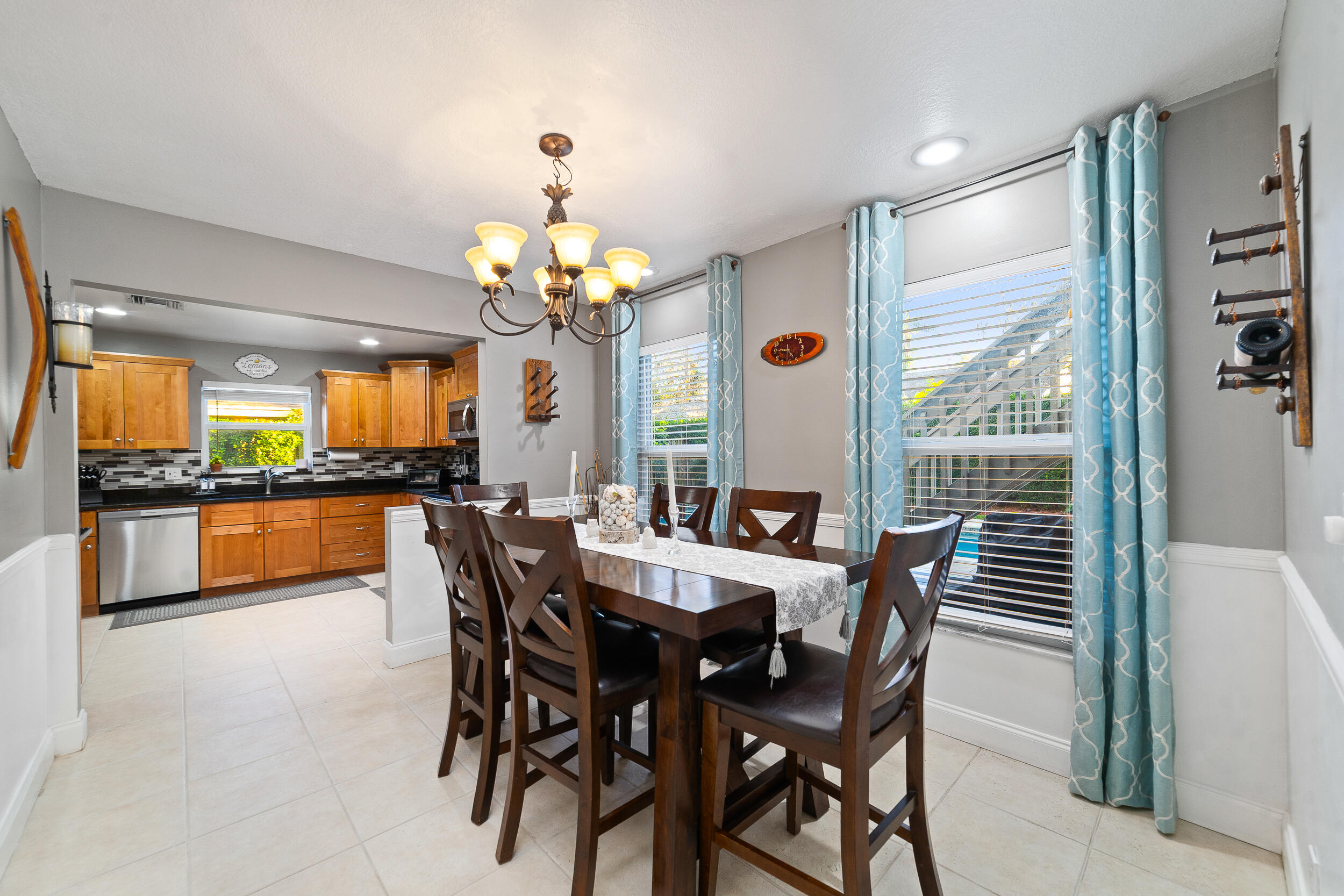 1045 Raintree Lane Wellington, FL 33414 - Photo 12 of 43 a dining room with furniture and window
