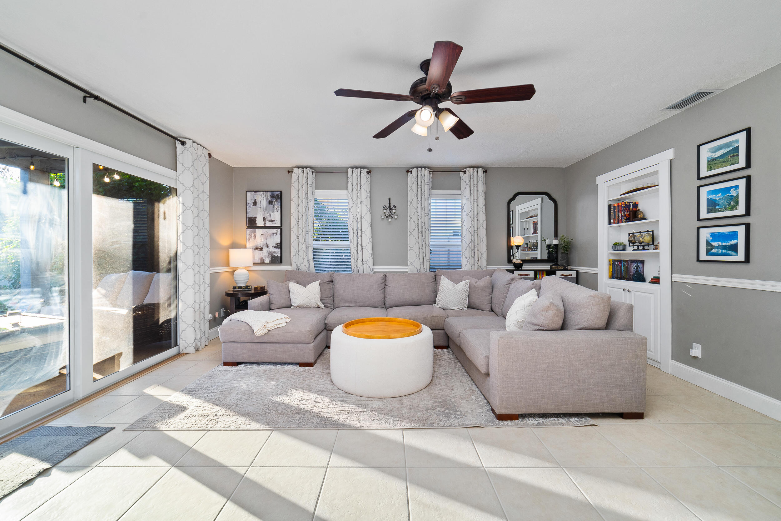 1045 Raintree Lane Wellington, FL 33414 - Photo 14 of 43 a living room with furniture and a large window