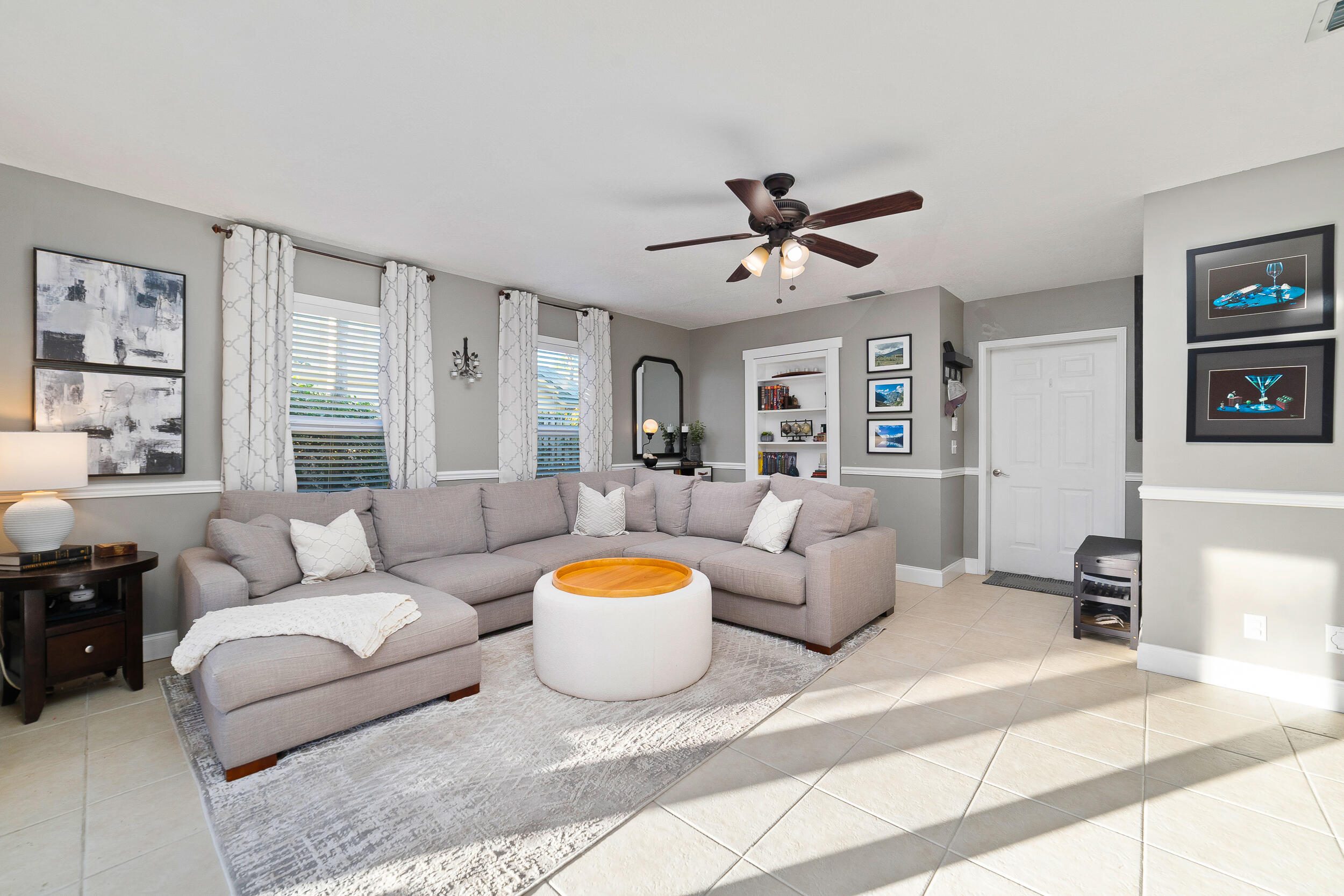 1045 Raintree Lane Wellington, FL 33414 - Photo 15 of 43 a living room with furniture and a large window