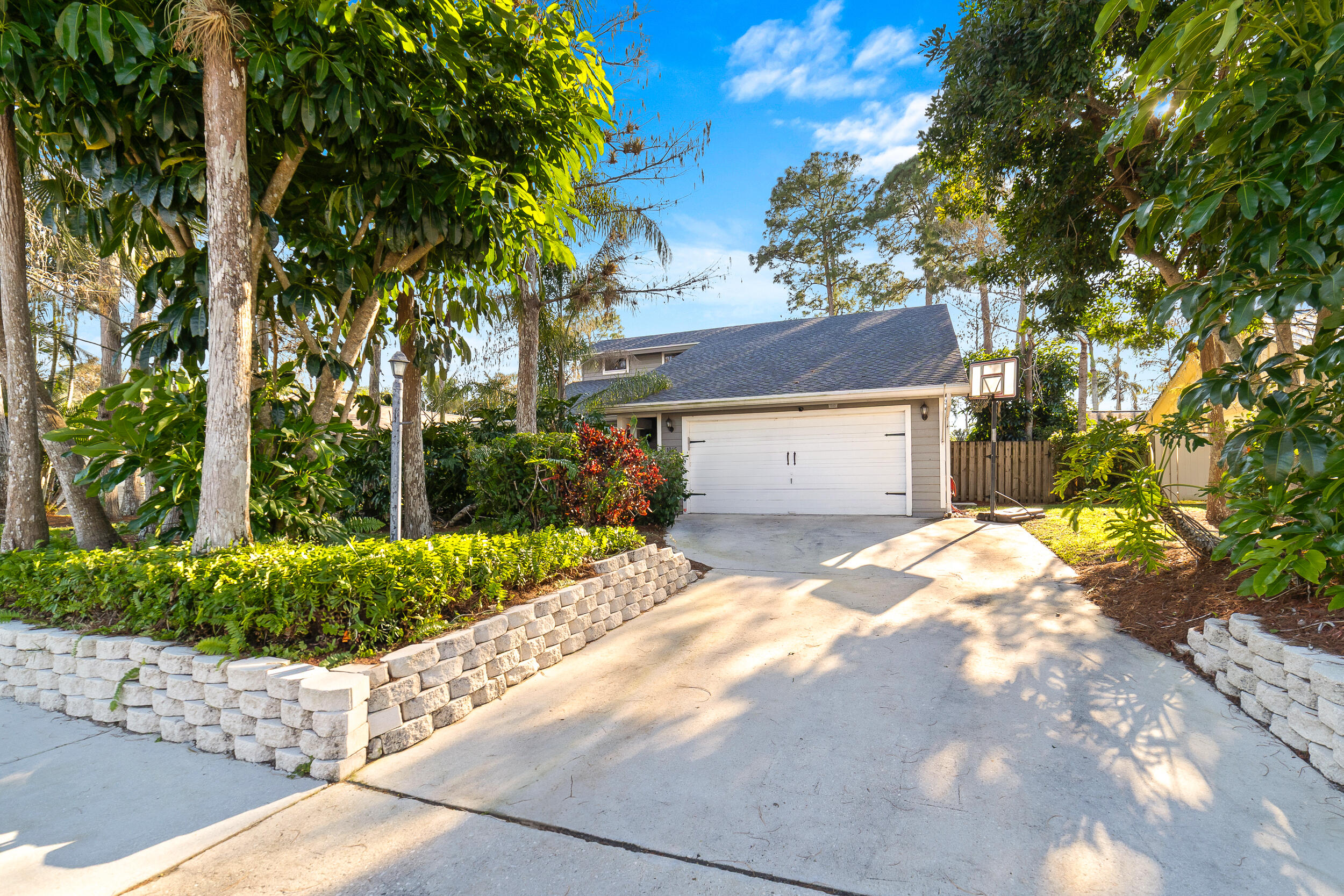 1045 Raintree Lane Wellington, FL 33414 - Photo 2 of 43 a house view with a backyard space