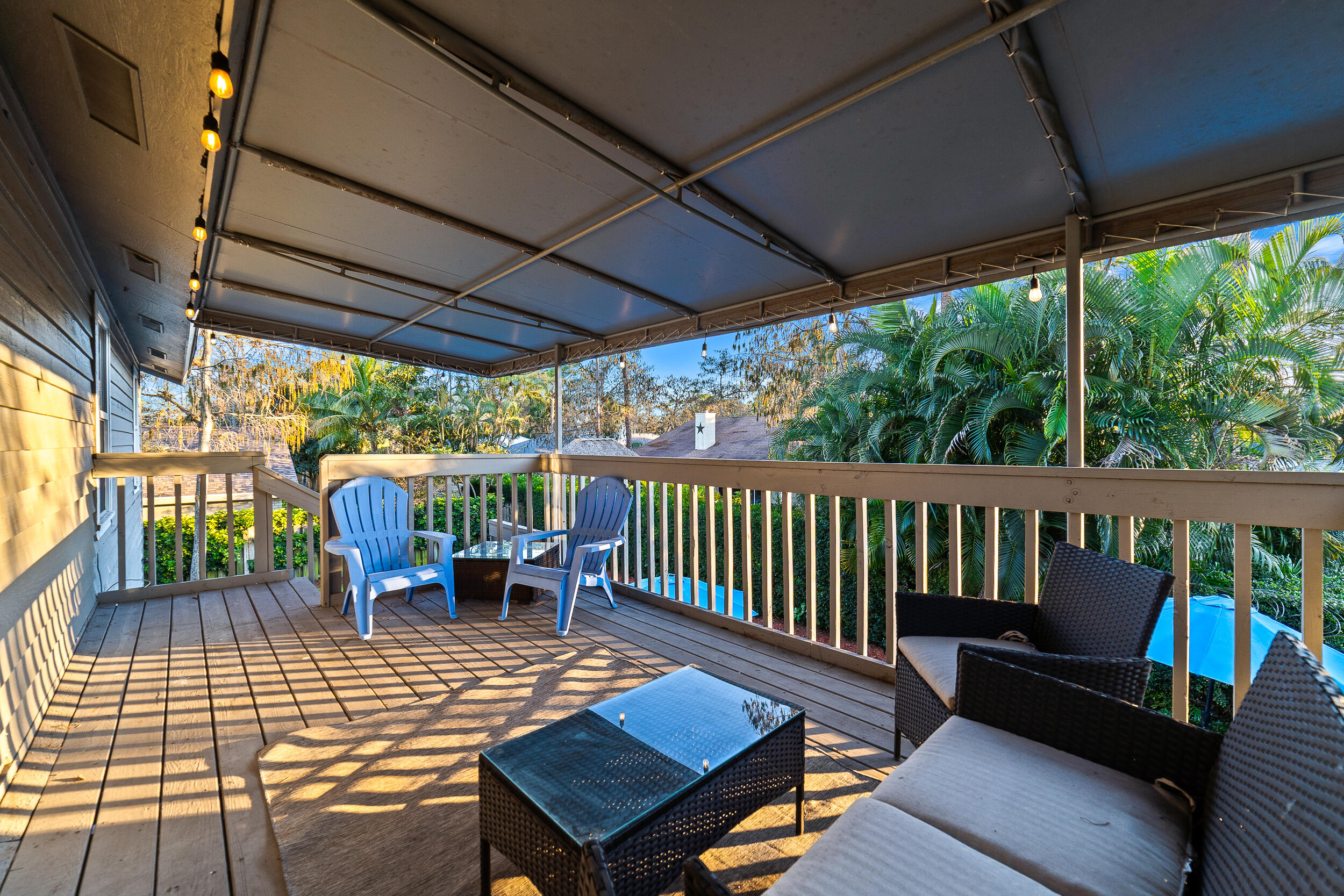 1045 Raintree Lane Wellington, FL 33414 - Photo 25 of 43 a view of a patio with a table chairs and a table
