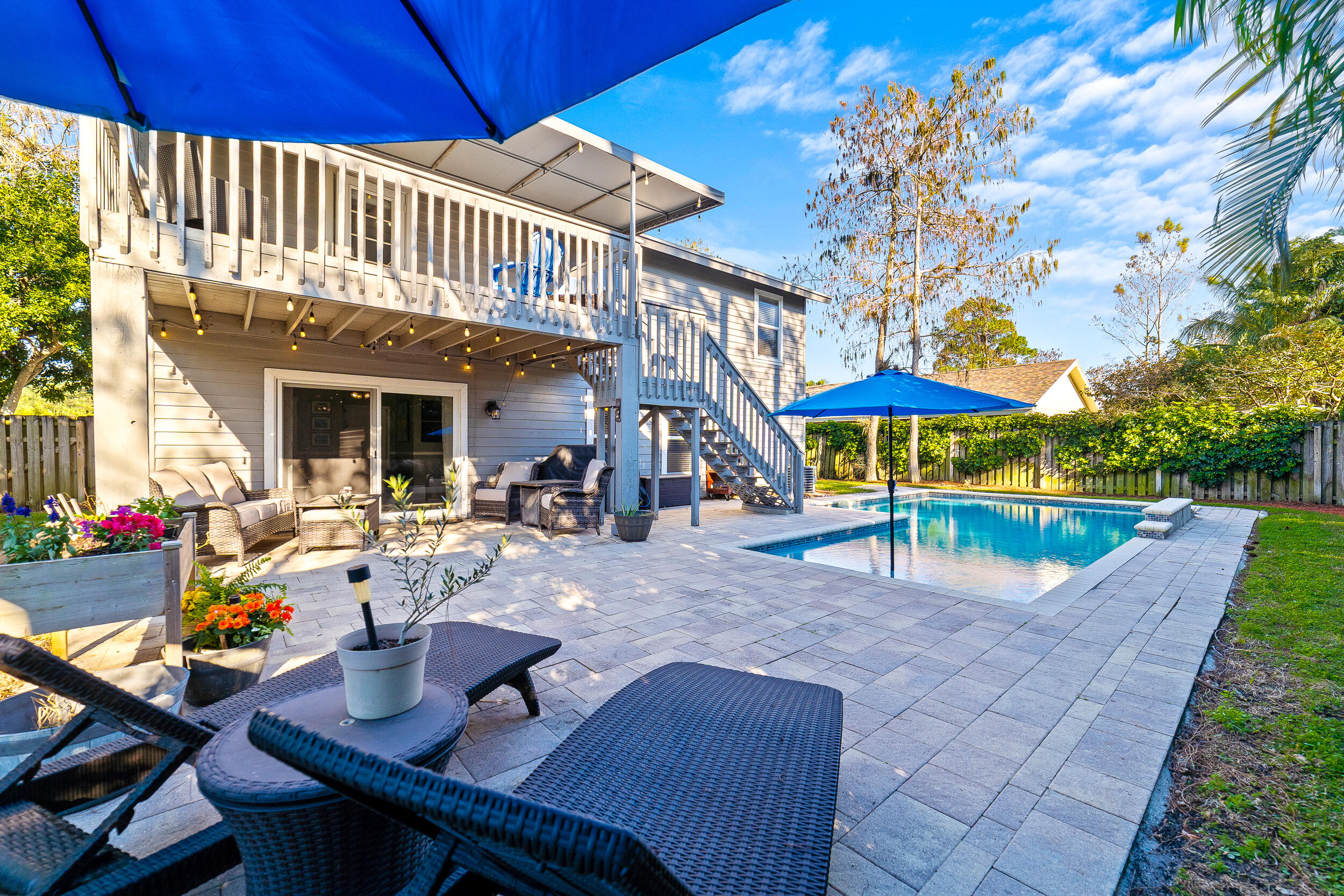1045 Raintree Lane Wellington, FL 33414 - Photo 29 of 43 a view of outdoor space yard deck patio and outdoor kitchen