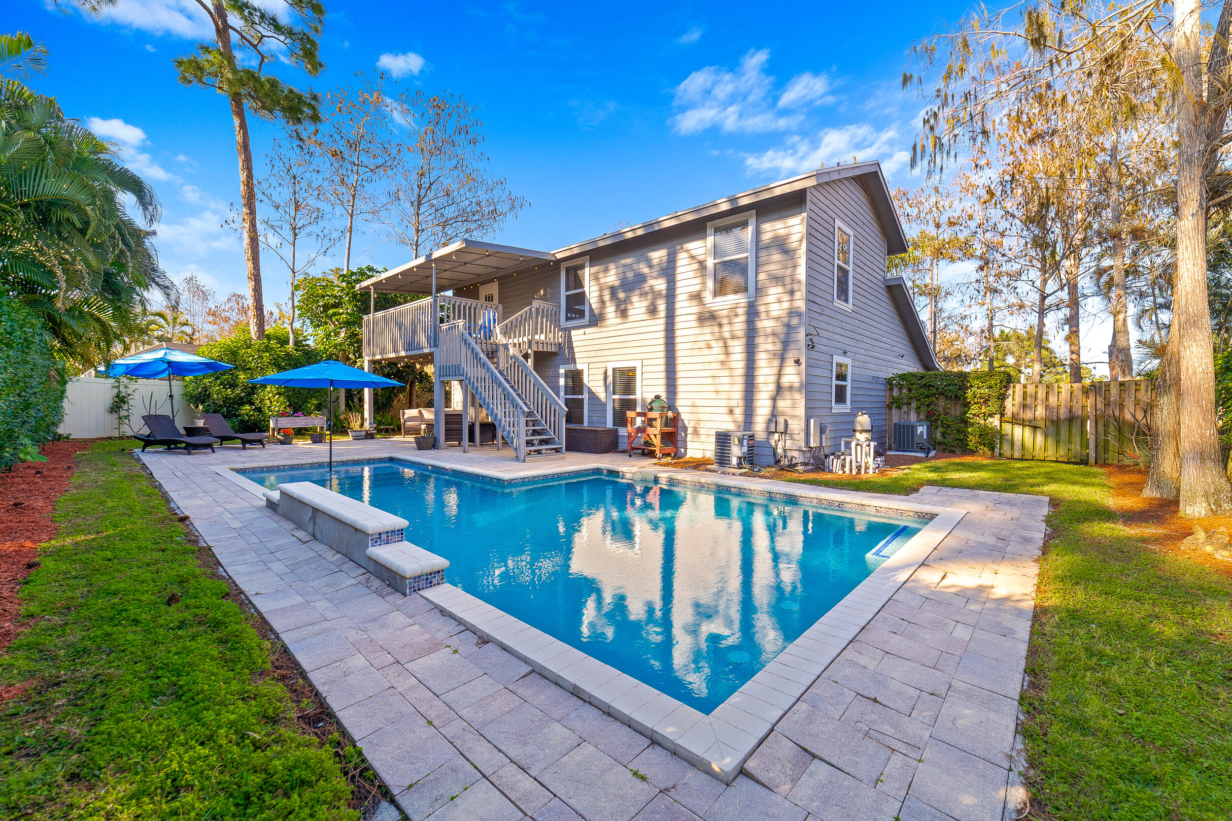 1045 Raintree Lane Wellington, FL 33414 - Photo 31 of 43 a view of a house with a yard