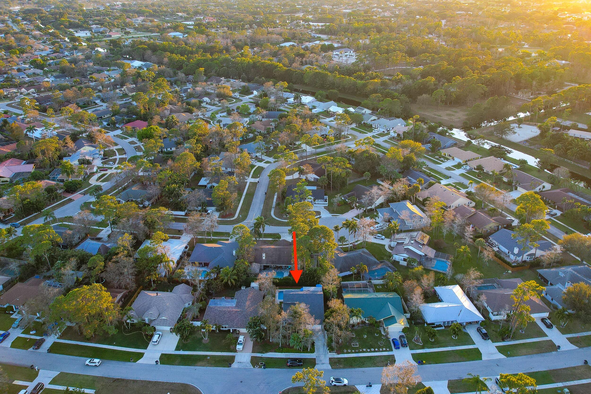1045 Raintree Lane Wellington, FL 33414 - Photo 41 of 43 an aerial view of residential houses with yard