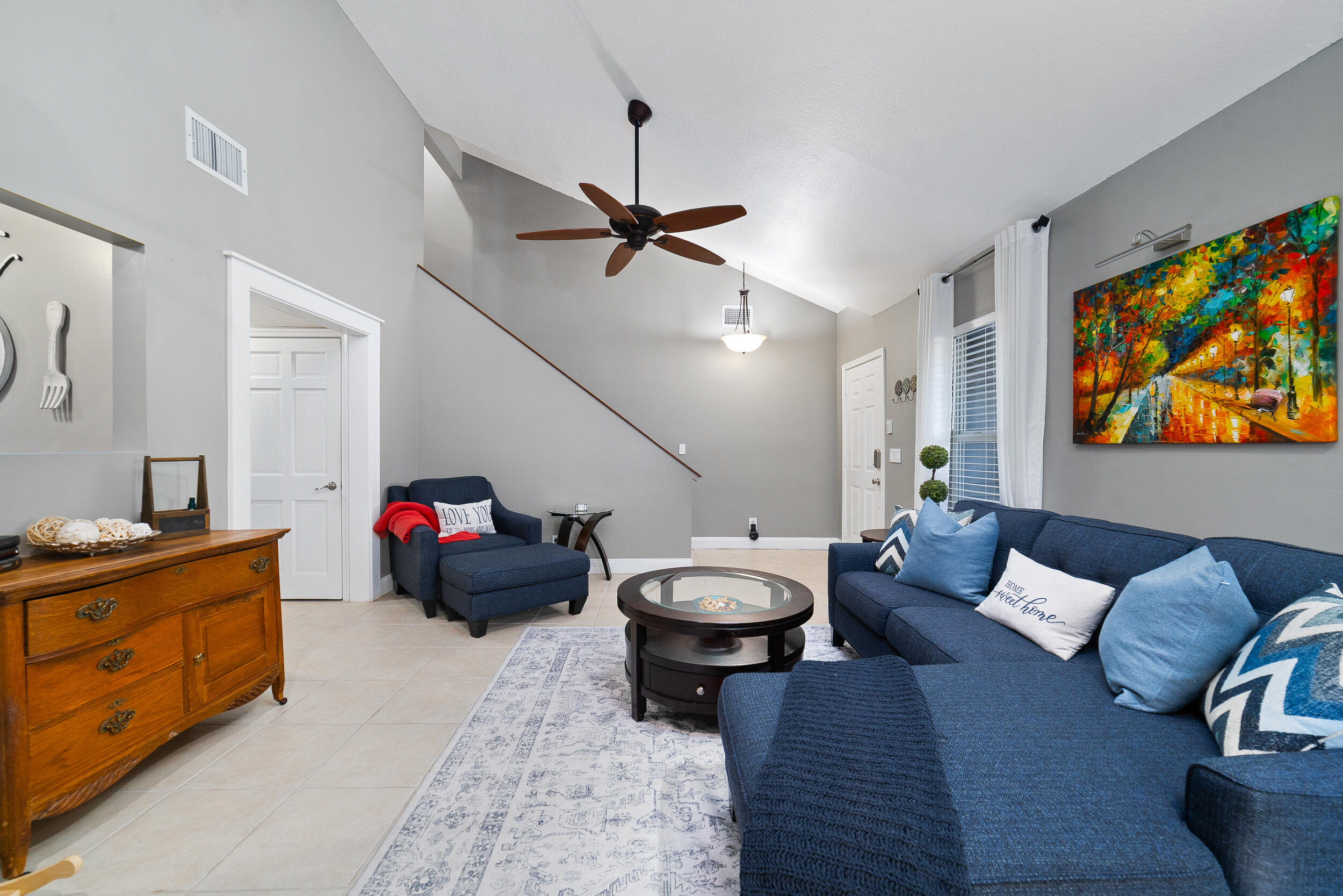 1045 Raintree Lane Wellington, FL 33414 - Photo 6 of 43 a living room with furniture and a flat screen tv