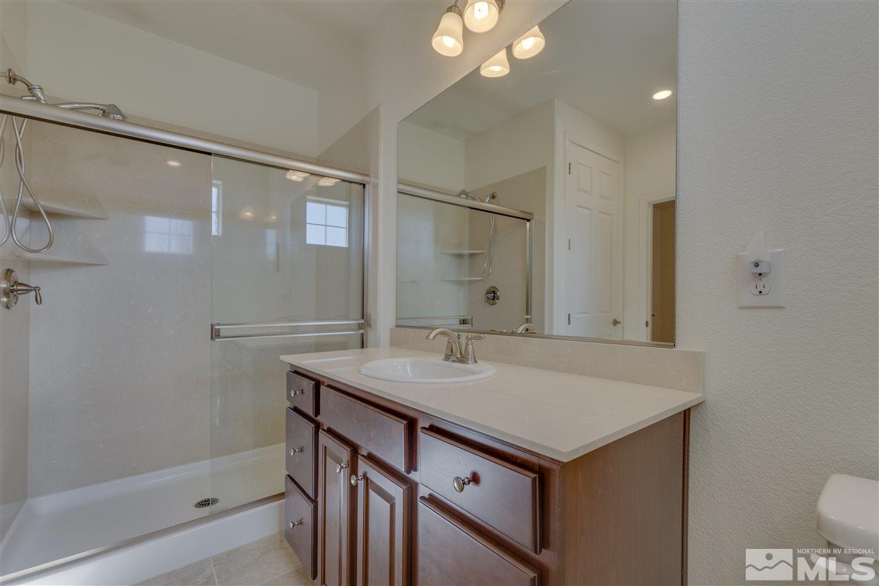 8845 Winter Peace Court Reno, NV 89523 - Photo 5 of 23 a bathroom with a sink and a mirror