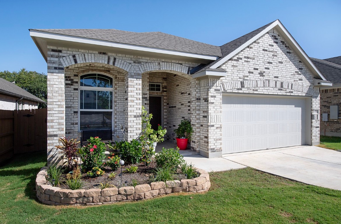 1016 Paddock Lane Georgetown, TX 78626 - Photo 1 of 1 a front view of a house with a yard