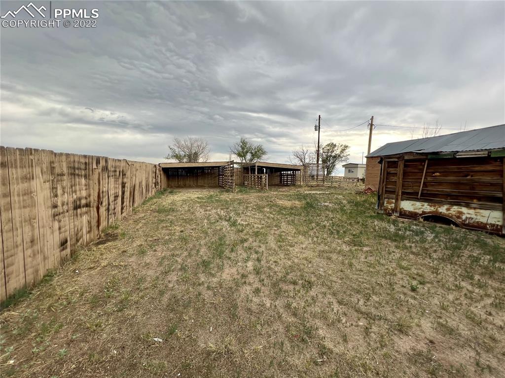 9456 McClelland Road Calhan, CO 80808 - Photo 25 of 31 a view of a terrace with a yard