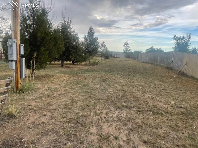 9456 McClelland Road Calhan, CO 80808 - Photo 6 of 31 a view of a field with trees in the background