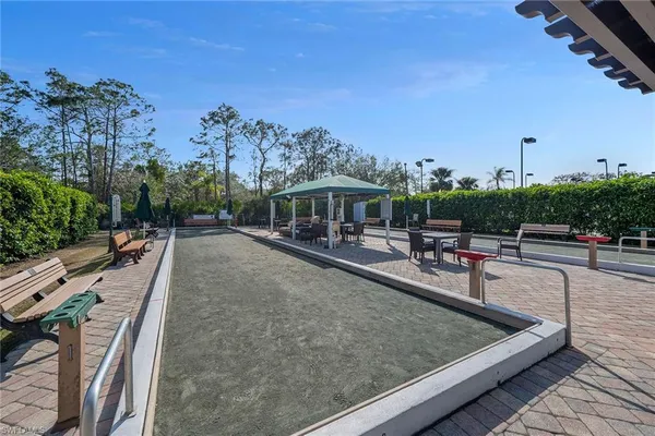 a view of a swimming pool with chairs
