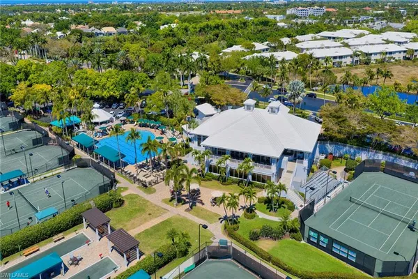 an aerial view of a houses with yard